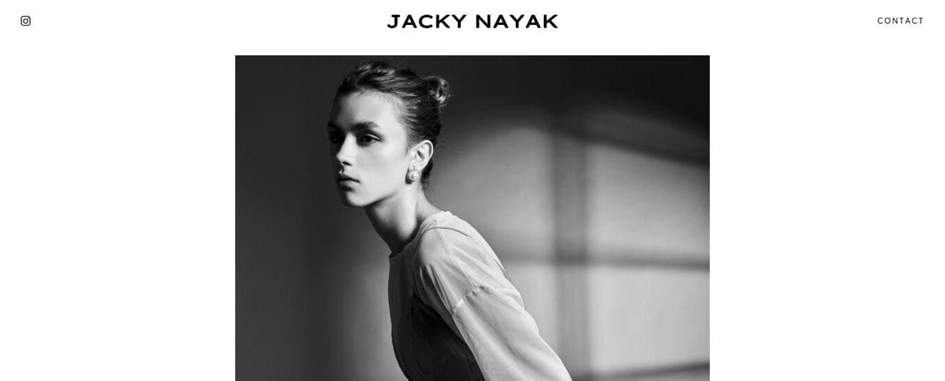 Jacky Nayak homepage with one black-and-white portrait under the wordmark